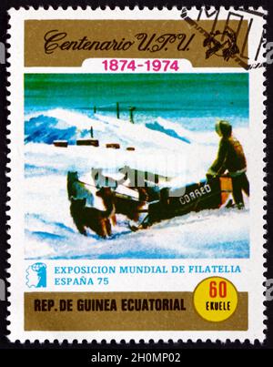 EQUATORIAL GUINEA - CIRCA 1974: a stamp printed in Equatorial Guinea shows Postman in sleigh, circa 1974 Stock Photo