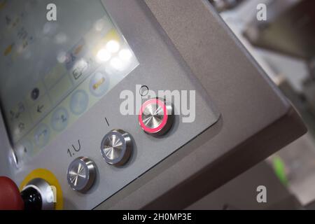Red button and touch screen display on the machinery in food industry Stock Photo