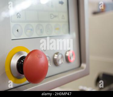 Red button and touch screen display on the machinery in food industry Stock Photo