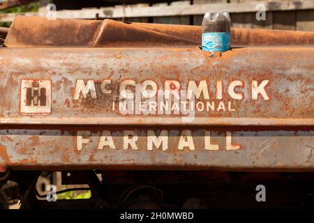 Pilcopata, Peru - April 12, 2014: Close-up of an old tractor, Mc Cormick International Farmall, totally rusted, Pilcopata Stock Photo