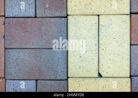 Close-up texture of a gray and yellow scratched paving slabs Stock Photo