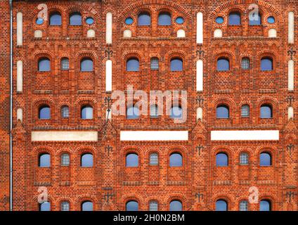 Red brick wall lines and windows Stock Photo