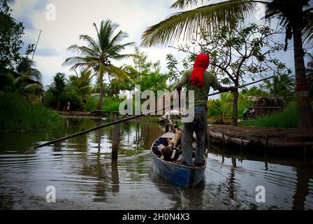 The Sinamaica lagoon is a large extension of water located northwest of Zulia state, Venezuela. The Sinamacia village inhabited by the ethnic Añu Indians is one of the last floating villages on earth. They have been living in the area in houses above water known as palafitos, since pre-colonial times. They use the water body for fishing, transport, and other activities. Wooden canoes or small motor boats are used for transportation. Life in the lagoon is currently threatened by social issues such as severe poverty, water contamination and global warming. Bolivian Republic of Venezuela. March 4 Stock Photo