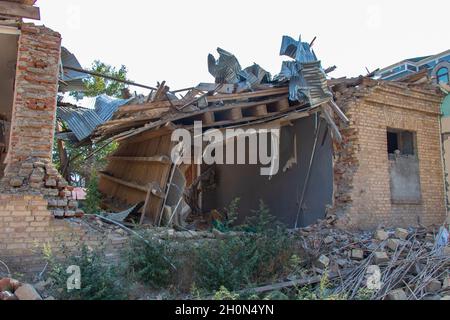 Ruined houses in Ganja city of Azerbaijan after the Armenian ballistic missile attack in October 2020. War results Stock Photo