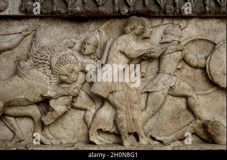 Siphnian Treasury, c. 525 BC. Marble of Paros. North frieze depicting a Gigantomachy. A lion biting a giant. The twins Artemis and Apollo fighting, th Stock Photo