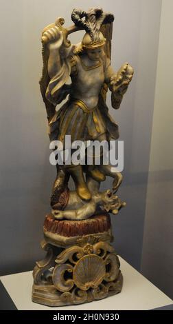 Statue of Archangel Michael slaying a dragon at the Mont Saint-Michel ...