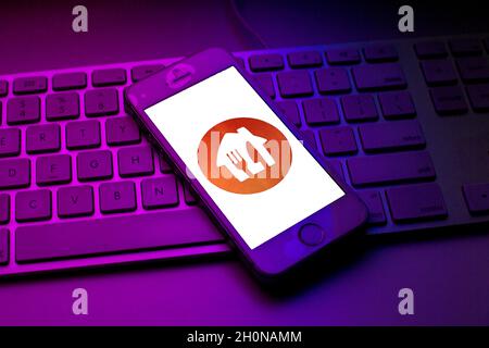 Spain. 13th Oct, 2021. In this photo illustration a Just Eat Takeaway logo seen displayed on a smartphone on top of a computer keyboard. Credit: SOPA Images Limited/Alamy Live News Stock Photo