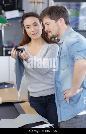 couple doing house chores assembling Stock Photo