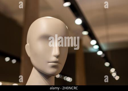 Head of a white mannequin in the store. Faceless girl. Stock Photo