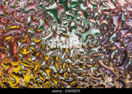 Macro shot of colorful water drops on glass. Abstract background. Stock Photo