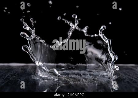 Water splash isolated on black background.  Water texture. Stock Photo