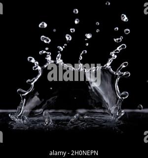 Water splash isolated on black background. Water texture. Stock Photo