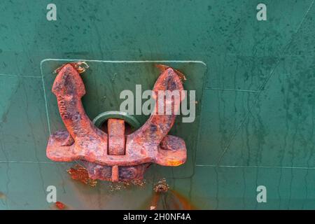 Old rusty ship anchor with a copy space. Stock Photo