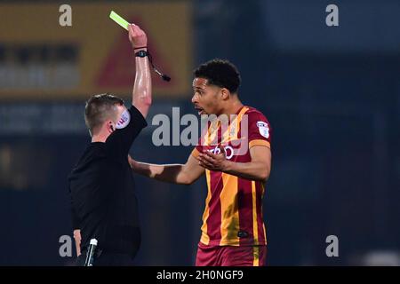 Bradford City’s Timothy Dieng is booked by Match referee David Webb Stock Photo