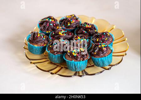 Chocolate cupcakes on a glass plate Stock Photo