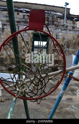 Old basketball hoops hanging around Stock Photo