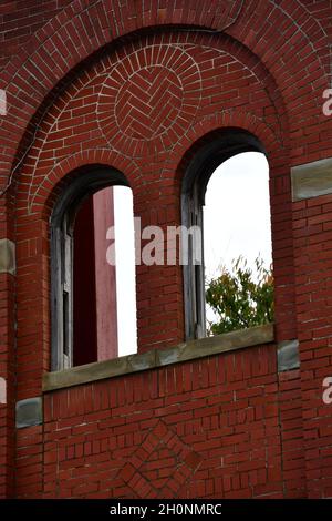 Old red brick buildings no longer in use. Stock Photo