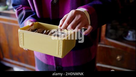 A man is choosing a photo slide Stock Photo