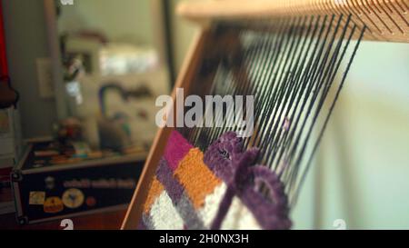 Close-up on a weaving board Stock Photo
