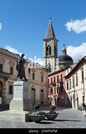 Sulmona Piazza XX Settembre with broze statue of Roman poet Ovidio , in the background  bell tower of Sulmona Cathedral Stock Photo