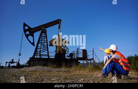 Squatting construction pointing finger hi-res stock photography and images  - Alamy