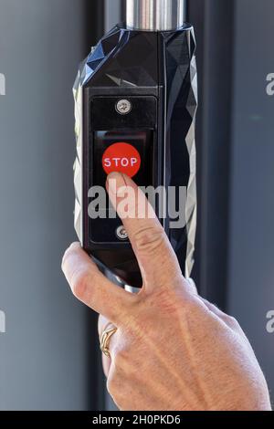 Brest (Brittany, north western France): stop request button in a tram of the Bibus public transport network in the metropolis of Brest red stop reques Stock Photo