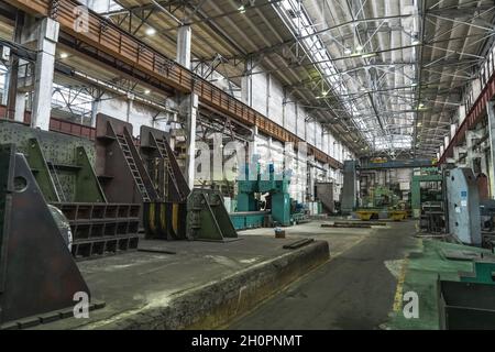 Industrial interior of metalworking factory. Workshop with many machine tools for metal processing, grinding, drilling and cutting. Heavy industry. Stock Photo