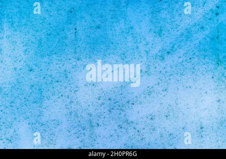The texture of the painted wall. Blue background with dirt, dots and deffects. Stock Photo