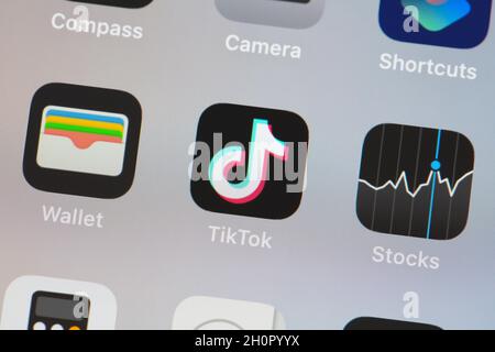 MOSCOW, RUSSIA - 13 OCT 2021: Tik Tok logo on the screen smartphone closeup Stock Photo