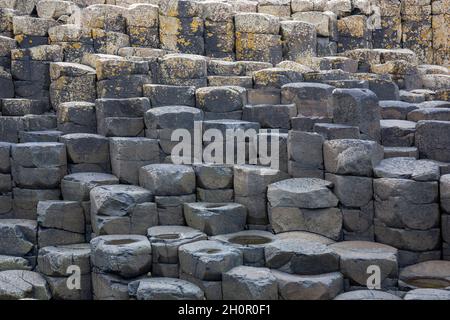 Giants Causeway, an area of hexagonal basalt stones, created by ancient volcanic fissure eruption, County Antrim, Northern Ireland. Famous tourist att Stock Photo