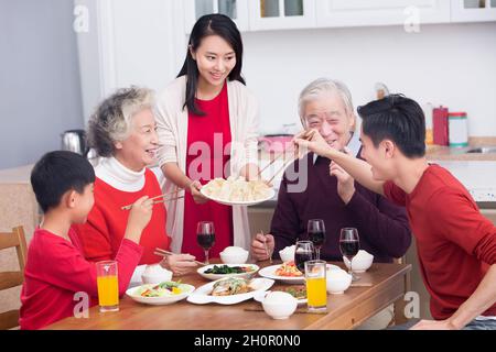 Families having a reunion dinner on New Year's Day Stock Photo