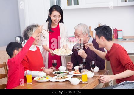 Families having a reunion dinner on New Year's Day Stock Photo