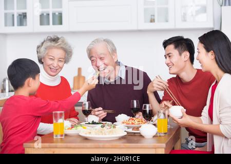 Families having a reunion dinner on New Year's Day Stock Photo