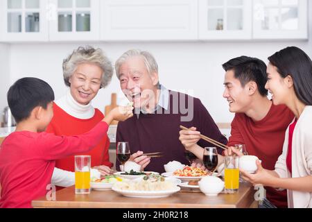 Families having a reunion dinner on New Year's Day Stock Photo