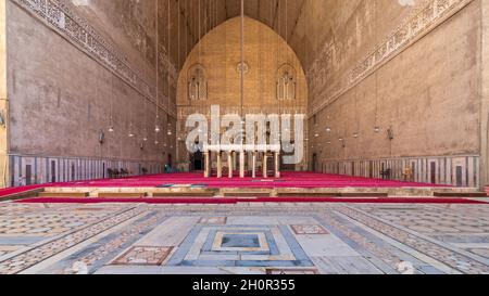 Cairo, Egypt- September 25 2021: Courtyard and monumental main Iwan of Mamluk era historical public Mosque and Madrasa of Sultan Hassan, Old Cairo