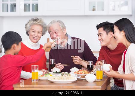 Families having a reunion dinner on New Year's Day Stock Photo