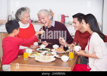 Families having a reunion dinner on New Year's Day Stock Photo