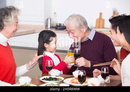 Families having a reunion dinner on New Year's Day Stock Photo