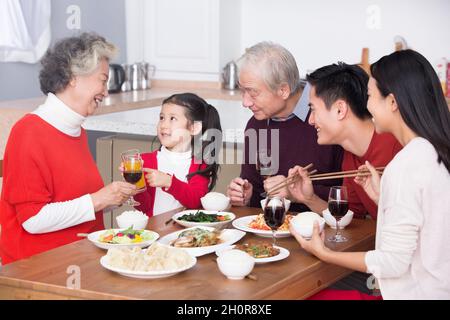 Families having a reunion dinner on New Year's Day Stock Photo