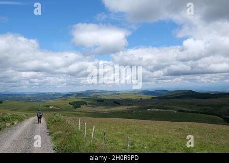 Landscape of the Cezallier Plateau in Anzat le Luguet (central southern France). In the background, the Cantal mountain range Stock Photo
