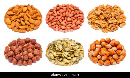 Set of different types of nuts and seeds - almond seeds, peeled peanut, peeled walnut, peeled ripe hazelnuts, pumpkin seeds without shell, ripe hazeln Stock Photo