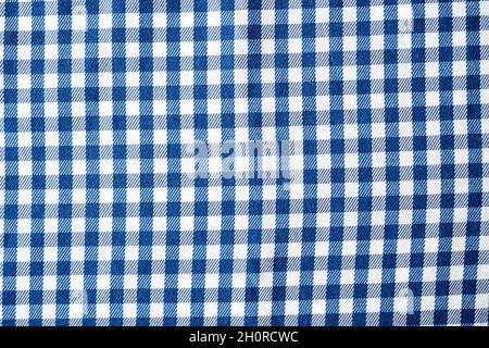 Checkered cloth, pattern of the small cages on the fabrick, seamless fabric cage as texture or background, top view Stock Photo