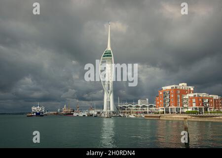 Spinnaker Tower on Portsmouth waterfront with dark moody sky behind.