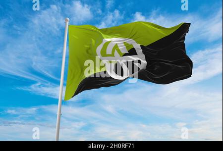 flag of Geo-Anarchist  at cloudy sky background on sunset, panoramic view. Anarchism symbol. copy space for wide banner. 3d illustration Stock Photo