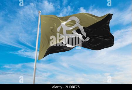 flag of Crypto-Anarchist  at cloudy sky background on sunset, panoramic view. Anarchism symbol. copy space for wide banner. 3d illustration Stock Photo