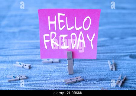 Hand writing sign Hello Friday. Conceptual photo used to express happiness from beginning of fresh week Piece Of Blank Square Note Surrounded By Stock Photo