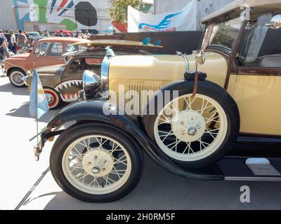 AVELLANEDA - BUENOS AIRES, ARGENTINA - Sep 27, 2021: shot of an old yellow Ford Model A Phaeton 1929. Side view. Nose. Expo Fierros 2021 classic car s Stock Photo