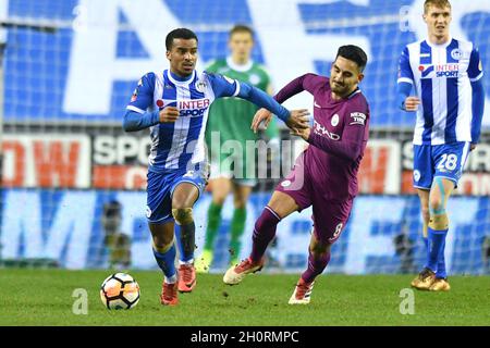 Wigan Athletic’s Nathan Byrne and Manchester City's Ilkay Gundogan in action Stock Photo