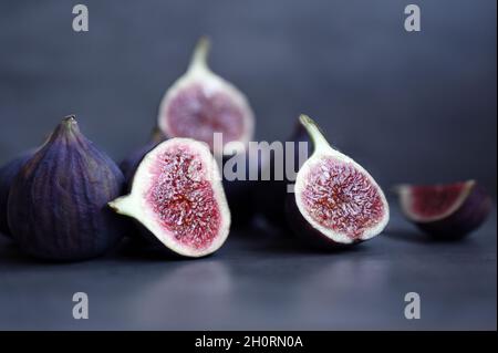 Fresh figs on violet background. Beautiful blue violet figs. Stock Photo
