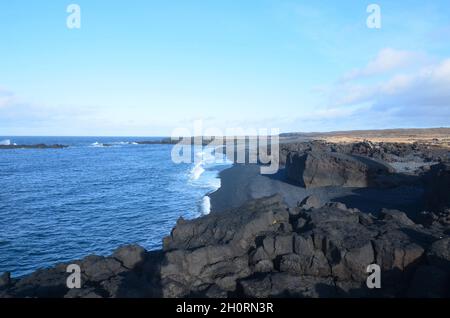 Black sand beach with lava rock at Dritvik. Stock Photo